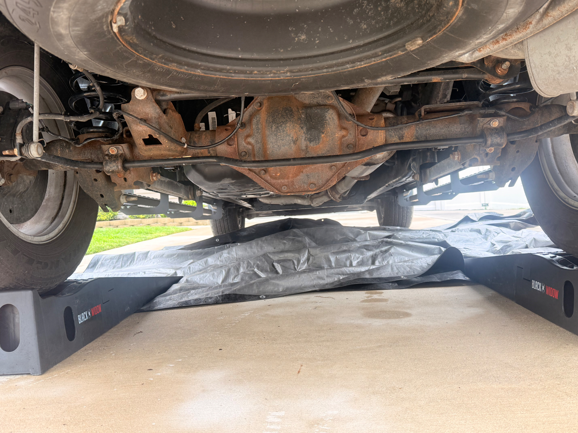Rusted truck frame before treatment